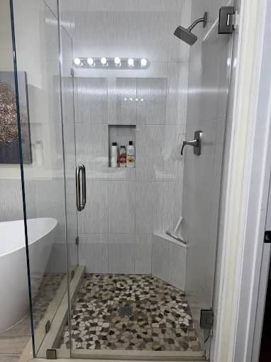 Mosaic-tiled shower scrubbed grout-deep during a deep clean