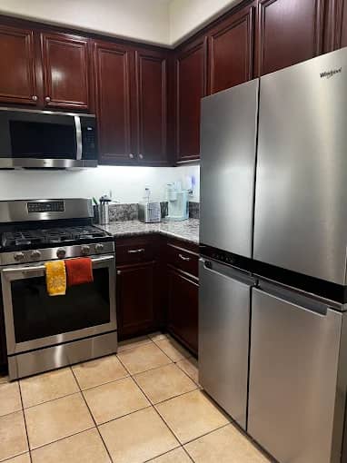 Dark cabinetry kitchen detailed after renovation