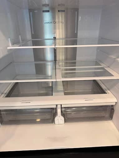 Spotless refrigerator interior after a move-out cleaning